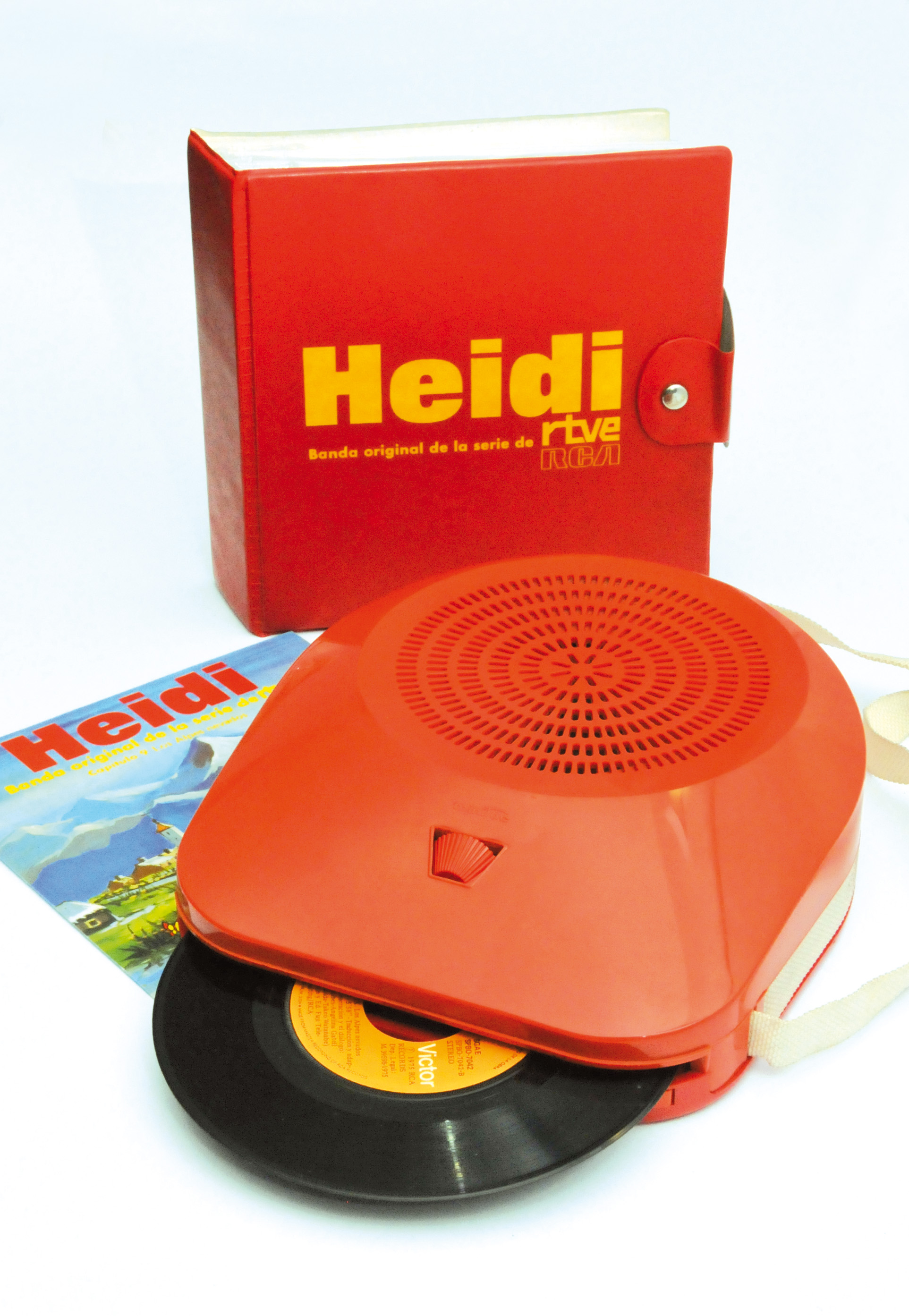 Comediscos rojo con un single y la carpeta de Heidi.