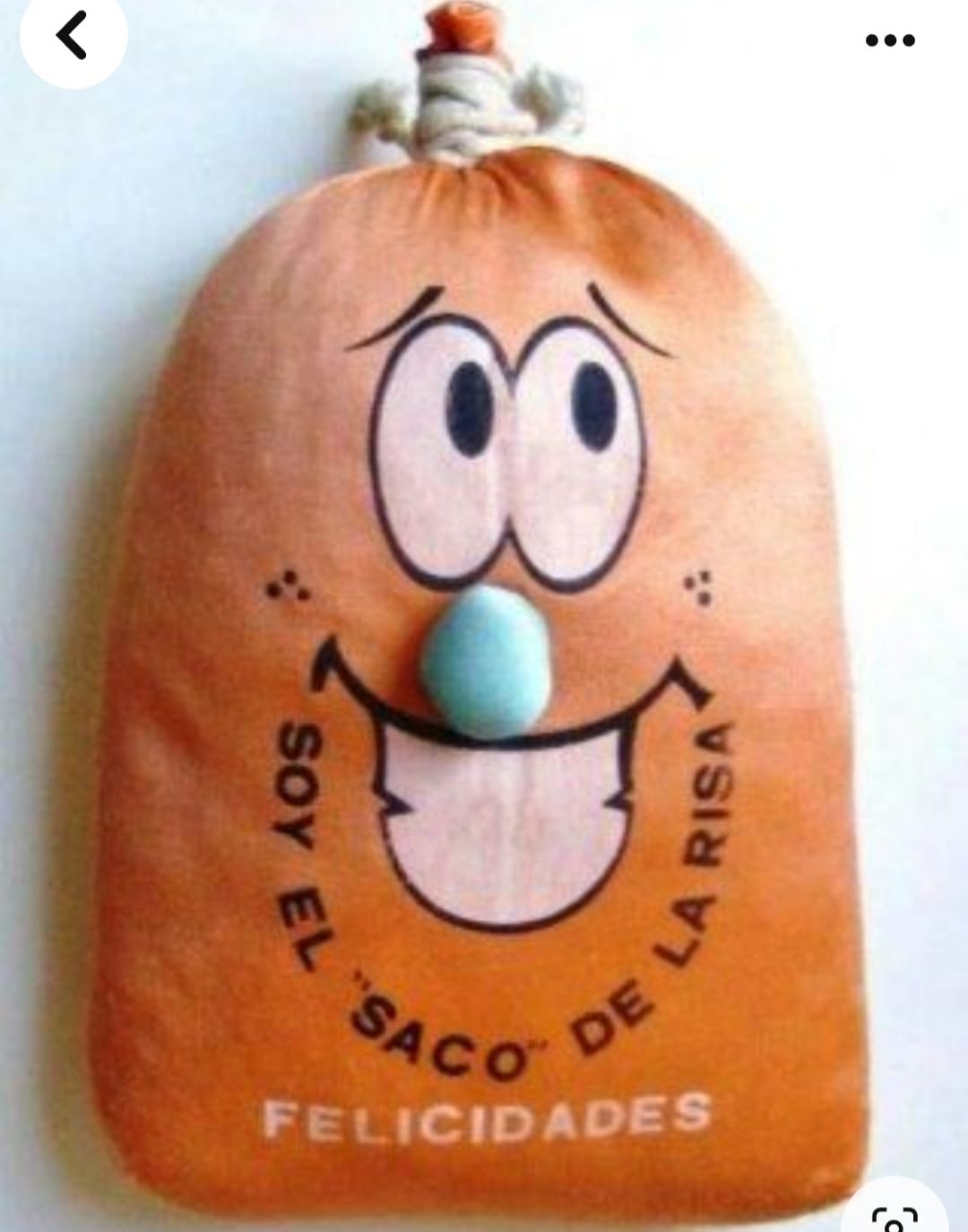 Saco de tela naranja con una cara sonriente y el texto Soy el saco de la risa.