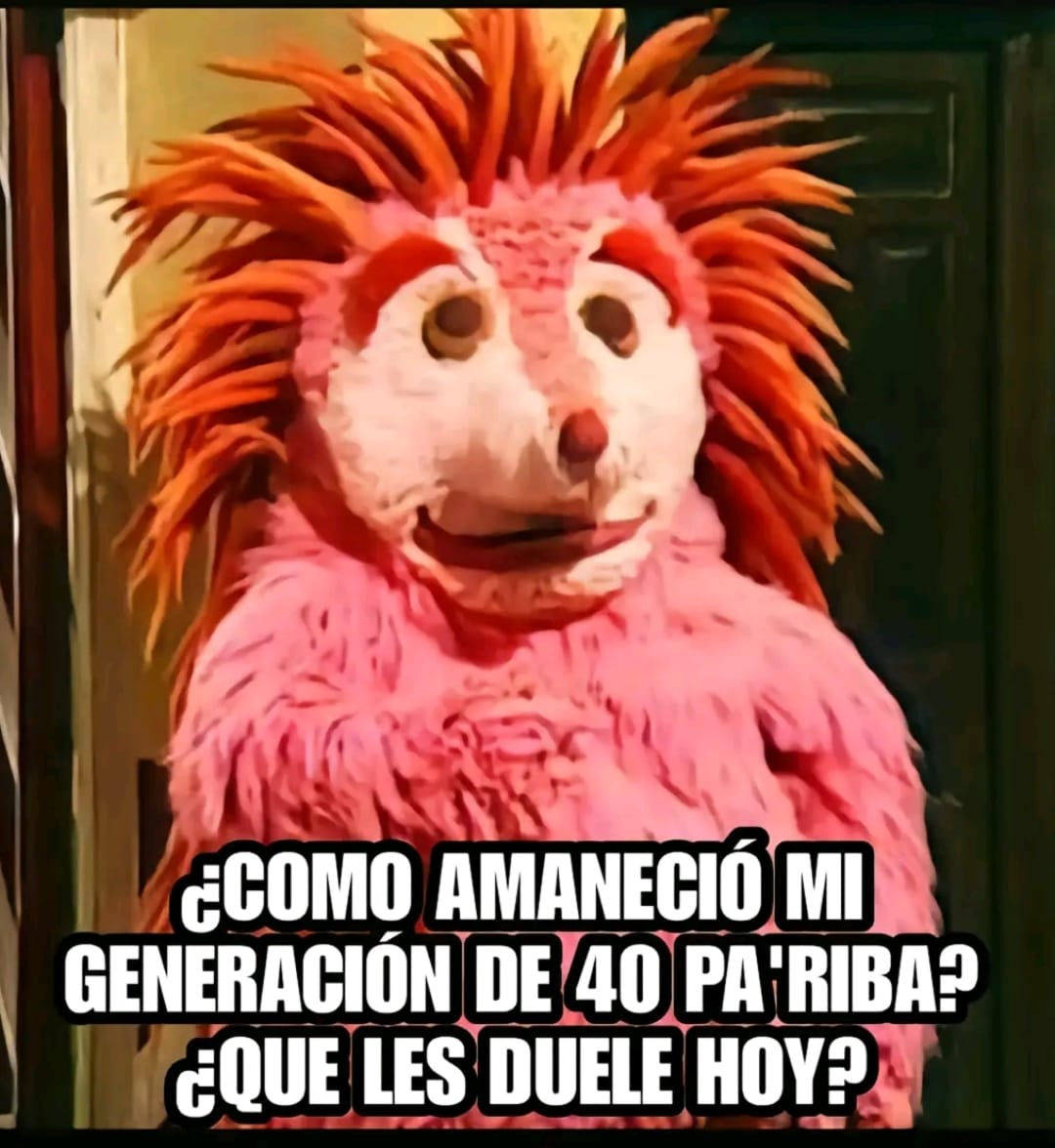 Espinete, el personaje de Barrio Sésamo con cuerpo rosa y púas naranjas.