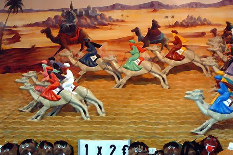 Atracción de feria de carrera de camellos.