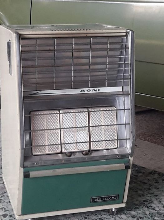 Estufa de butano antigua con ruedas