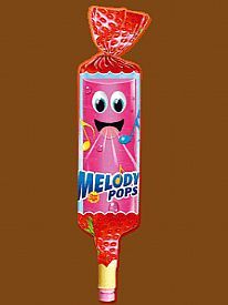 Caramelo Melody Pops de fresa con forma de silbato y cara sonriente.